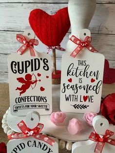 two valentine's day gift tags on top of each other with hearts and ribbons