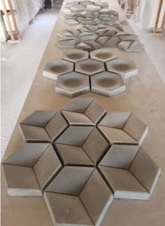 several hexagonal tiles are lined up on the floor