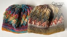 two knitted hats sitting next to each other