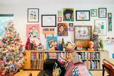 a living room filled with lots of christmas decorations