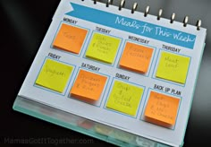 a calendar with sticky notes attached to it