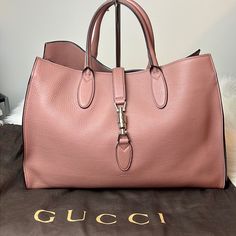 Nwot Gucci Jackie 1961 Large Pebbled Leather Rose Blush Handbag Satchel Tote Bag Purse Authentic Gucci Pebbled Leather Piston Closure Silver-Tone Hardware Large Roomy Interior (Large Enough To Carry Laptop Or Ipad In) (2) Interior Side Zip Pockets Made In Italy Gucci Dust Bag & Leather Sample Patch Included Matching Michael Kors Wallet In The Same Pebbled Leather Almost Identical Color Also Available For Purchase In My Closet. Bundle Both For Free Shipping. Gucci Bag With Silver-tone Hardware For Everyday Use, Pink Gucci Bag With Branded Hardware, Chic Gucci Bag With Silver-tone Hardware, Pink Leather Bags For Everyday Luxury, Gucci Pink Bag With Detachable Strap, Gucci Travel Bags With Silver-tone Hardware, Gucci Bag With Silver-tone Hardware, Pink Gucci Bag With Gold-tone Hardware, Pink Gucci Bag For Daily Use