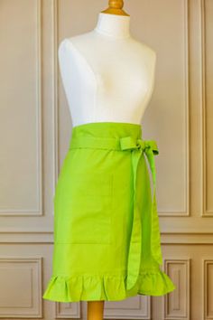 a mannequin wearing a lime green skirt with ruffles on the bottom