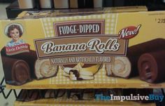 two boxes of fudge - dipped banana rolls are stacked on top of each other