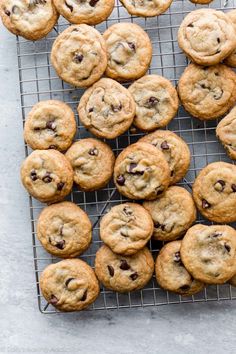 chocolate chip cookies on a cooling rack ready to be eaten by someone who is about to eat them