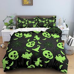 a bed covered in green and black halloween themed sheets