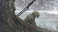 a man sitting on top of a boat in the snow with his head turned to the side