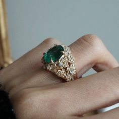 Read about our payment plans before proceeding. Our "Tulip Majesty Emerald Bloom Ring." A mesmerizing oval emerald, reminiscent of a lush oasis, is embraced by delicate tulip petals, accented by sparkling diamonds. Experience the essence of spring's romance captured in this timeless treasure. Perfect for those who seek nature's elegance and enduring beauty. Crafted by skilled hands, this ring is available in your choice of 14K and 18K yellow gold, rose gold, and white gold. All emeralds are natural so it can differ from the image. All orders come in our Tippy Taste ring box. This ring is handmade and designed in NYC. 14K or 18K solid gold Natural 10*8mm oval emerald. Approx. 2.5ct Natural diamonds. SI clarity, GH color, 0.08ct total carat weight ** Tippy Taste Heirloom Collection is made t Exquisite Oval Emerald Ring With Rose Cut Diamonds, Unique Oval Emerald Ring, Exquisite Oval Emerald Ring, Unique Oval Emerald Ring In 14k Gold, Luxury Oval Emerald Jewelry, Gold Emerald Ring With Intricate Design, Oval Shape, Tulip Petals, Emerald Jewellery, Expensive Rings