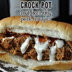 a close up of a sandwich on a plate with the words crock pot root beer bbq pok hoagies