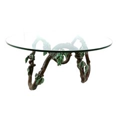 a glass table with branches and leaves on it