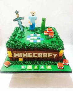 a cake made to look like a minecraft field with a man standing on top