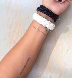 a woman's arm with two different bracelets on it and the words, love is