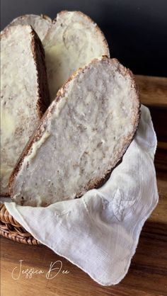 two loaves of bread sitting in a basket