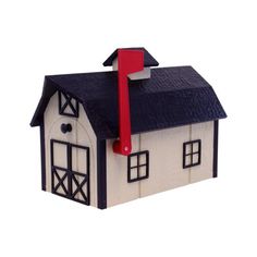 a toy house with a red arrow on the roof