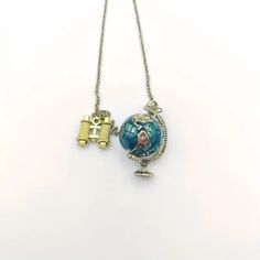 Unleash your inner wanderlust with our Globe Traveler Necklace. The perfect accessory for the adventurous soul, this necklace features a globe pendant that symbolizes wanderlust and exploration. Take your love for traveling with you wherever you go! (Travel the world in style!) Travel Pendant Jewelry With Compass Design, Handmade Adjustable Jewelry For Travel, Travel-themed Compass Design Round Pendant Necklace, Adjustable Compass Design Jewelry For Travel, Travel Necklace, A Globe, Brooch Necklace, Globe Pendant, Travel The World