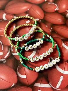 - Calling all Philly football fans! Personalize your custom eagles bracelet for game day. Choose from seed bead with 18k gold accents or a full gold beaded beaded with green accents. Gold filled beads are much more tarnish resistant and long lasting, opposed the the more commonly seen gold plated. These bracelets layer well with others so add this to your stack for your next tailgate! Beaded on high quality stretch cord and secured. - Listing is for (1) bracelet or set of (2). Set includes (1) g Eagles Bracelet, Football Eagles, Philly Football, Eagles Gear, Preppy Bracelets, Eagles Football, Layered Bracelets, Green Accents, Philadelphia Eagles