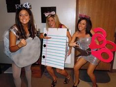 three women dressed up in costumes posing for the camera with paper cutouts and scissors