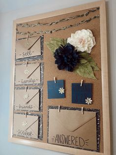 a bulletin board with clothes pins and flowers on it