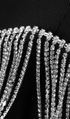 Did you see it? Is the diamond tassel shining far away enough to attract your attention? The shoulder pad design and chain fringe decoration have become the most wonderful highlight of this dress, which adds a lot of gorgeous temperament to its cool black dress! It will make you the center of the party! Gentle Dry Clean OnlyColour may vary due to lighting on images. The product images (without model) are closest to the true colour of the product.Item runs true to size chart and is cut to suit ou Black Tassel Dress, Shine Like A Diamond, Money Collection, Chain Fringe, Casual Dress Pants, Timeless Dress, Pad Design, Plus Size Shopping, Knitted Dress