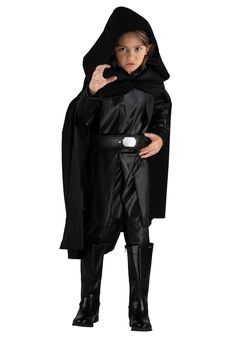 a little boy dressed as darth vader from star wars is posing for the camera