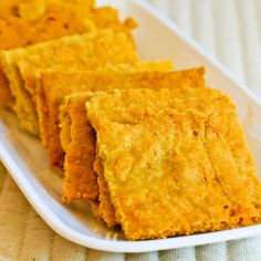 some food is on a white plate and it looks like cornbreads or crackers