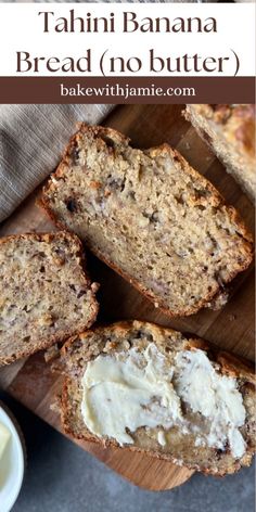 banana bread with butter is cut in half on a cutting board