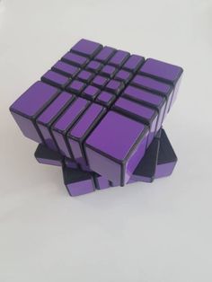 a purple and black cube sitting on top of each other