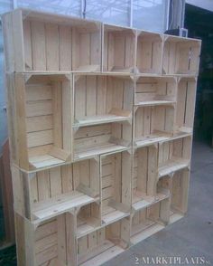 several wooden shelves stacked on top of each other