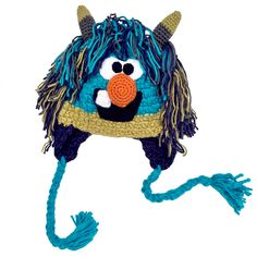 a crocheted blue and yellow hat with an orange nose