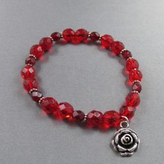 "Red Czech Glass Faceted Rondelle Bead & Silver Flower Bracelet Length: 7-8\" (Adjustable) All items are handcrafted and individually designed.  Wear PiecesByPortia....and Accessorize Your Style!" Czech Beads Jewelry, Czech Glass Bead Bracelet, Silver Flower Bracelet, Beaded Jewelry Bracelets, Paper Earrings, Beaded Wrap Bracelets, Leather Floral, Beaded Wraps, Glass Beaded Bracelets