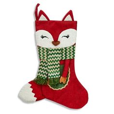 a christmas stocking with a red fox wearing a green and white scarf on it