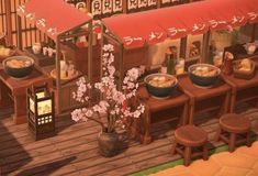 an animated image of a japanese restaurant with food on the table and flowers in vases