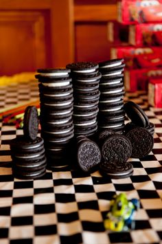 stack of oreo cookies sitting on top of a checkered table