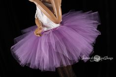 "Make a huge impression with this massive royalty peek a boo style tutu! This tutu is handmade from 35yards of soft smooth Bridal tulle in three layers of light purple that has been gathered and serged to the matching fabric covered elastic waistband. LENGTH 13\" long Measurement: Sizes go by smallest waist size tutu will fit to largest Hips tutu fits over Child size 20\"-30\"inches 12\" long (good for ages 4-13) Adult sizes Please go by your waist size not your hips. Tutu will have plenty of st Fitted Purple Skirt For Costume, Fitted Lavender Skirt For Party, Fitted Purple Petticoat For Party, Fitted Purple Tutu Dress For Costume, Purple Tulle Tutu Dress For Costume Party, Purple Tulle Tutu Dress For Wedding, Fitted Lavender Tulle Tutu Dress, Purple Fitted Tutu Dress With Ruffles, Lavender Princess Style Tutu Dress