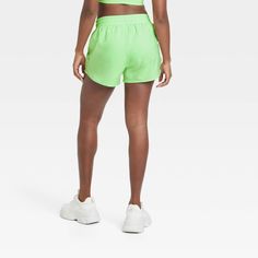 Why we're ALL IN: Mid-rise shorts designed in a solid hue to take you through anything from training sessions and walks to intense runs in effortless comfort. Tailored in regular-fit, these mid-rise shorts are designed from a moisture-wicking fabric with a quick-dry finish to help keep you cool and dry. A full elastic waistband provides a secure fit, while a side zippered pocket finishes off the sporty look. All in Motion™: Made for every move, priced for every day. Green Athleisure Shorts For Running, Green Athleisure Running Shorts, Short Spring Activewear For Training, Short Activewear For Spring Training, Spring Training Activewear Shorts, Sporty Jogging Shorts, Green Short Activewear For Running, Green Athletic Shorts For Running In Spring, Green Moisture-wicking Athletic Shorts For Spring