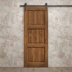 an open wooden door in front of a concrete wall