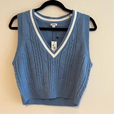 Little Cropped, Baby Blue Mini Sweater Vest From Garage. Cable Knit, And V-Neck With A White Stripe Around The Neckline. Brand New With Tags! All Measurements Are Approximate And Taken With The Item Laid Flat. Chest: 16" Hips: 14" Length: 18" Sleeve: 3.5" Waist: 15" Affordable Blue V-neck Vest, Light Blue Sweater Vest, Blue Sweater Vest, Cropped Wool Sweater, Womens Black Sweater, Mini Sweater, Cropped Knit Sweater, Blue And White Style, Sweater Vest Women