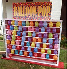 the balloon pop sign is on display outside