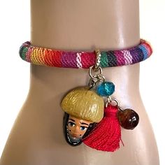 These are beautiful artisanal bracelets that will make an excellent accessory and pop of color for any outfit. Each piece is completely unique and 100% hand made by a local artisan in Tuxtla Gutierrez, Chiapas Mexico. The bracelets have an adjustable slide knot. They each come with 1 natural Chiapas amber bead, 1 Parachico, 1 tassel and 3 other beads.  Red Tassel Bracelet  Width - 1/2 cm Parachico - 1 inch Tassel - 1 inch Fits wrists between 5" - 9.5" Blue Tassel Bracelet  Width - 1 cm Parachico - 1 inch Tassel - 1 inch Fits wrists between 5 1/2" - 9" All of our handcrafts and folk art are handmade and may have slight imperfections that make them unique & one of a kind. Colors vary slightly depending on the lighting or viewing screen. Bracelet Mexican, Tassel Bracelet, Blue Tassel, Art Populaire, Amber Beads, Macrame Bracelets, Local Artisans, Braided Bracelets, Friendship Bracelet