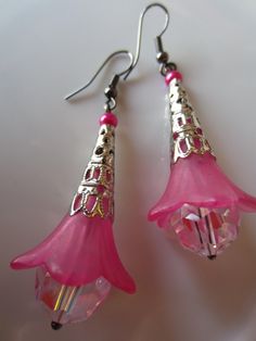 "🌸🌼Pink Flower Earrings🌼🌸 These are beautiful hot pink earrings!  Great for spring and summer.  Get rid of those winter blues!  The earrings hang 2 1/2\" and are 3/4\" wide.  The earrings feature hot pink lucite flowers, austrian crystals with an aurora borealis finish, and silver cone filigree bead caps.  These are real stunners!" Handmade Pink Teardrop Flower Earrings, Pink Earrings With Ear Wire For Spring, Pink Whimsical Flower Earrings For Pierced Ears, Whimsical Pink Nickel-free Earrings, Whimsical Pink Flower Earrings For Pierced Ears, Whimsical Nickel-free Pink Earrings, Pink Dangle Flower Earrings For Spring, Pink Flower Earrings With Ear Wire For Spring, Pink Teardrop Flower Earrings With Ear Wire