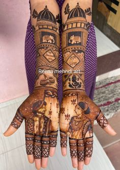 two hands with henna designs on them, one is holding the other hand up