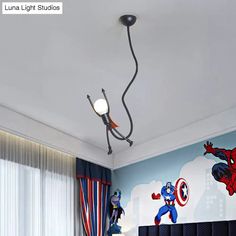 a bedroom with captain america wallpaper on the walls and an iron spiderman mural