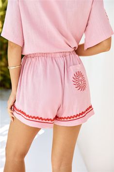 Length from waist to hem of size S: 33cm. Shorts. Unlined. Red wavy trim. Model is a standard XS and is wearing size XS. True to size. Non-stretch. Elastic waist. Flowy style. Embroidered sun on back pocket. Slip on. Cold hand wash only. Cotton/Linen. Soak up the summertime feeling in the Smiling Sun Linen Blend Shorts. Featuring a red wavy trim, an elastic waist and an embroidered sun motif on the back pocket. Style with the matching top for the complete 'fit. Embroidered Sun, Sun Motif, Smiling Sun, Flowy Style, Purple Paisley, Halter Maxi Dresses, Maxi Dress Blue, Matching Top, Trending Now