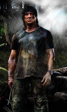 a man standing in the rain holding an arrow and looking at something with his eyes closed