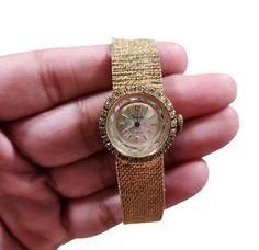 This vintage Sheffield wristwatch is a dazzling addition to any collection. The gold-filled case and band are complemented by rhinestones for a glamorous touch. With 17 jewels, this watch is sure to keep accurate time. The watch is pre-owned but has been well-maintained and is in excellent working condition.  The watch is designed for women and is perfect for formal occasions. The band is 8 inches long and can fit most wrists. This watch is a great find for anyone who loves vintage jewelry. Gold Diamond Jewelry And Watches For Evening, Gold Diamond-accented Watch For Evening, Gold Watches With Diamond Accents For Evening, Gold Evening Watches With Diamond Accents, Gold Diamond Watch With Diamond Accents For Evening, Gold Diamond Accented Watch For Evening, Gold Diamond Watch For Evening, Gold Diamond Watch With Rhinestones, Gold Party Watches With Rhinestones