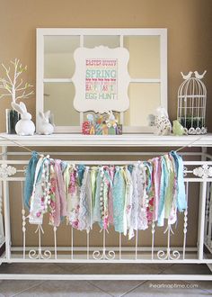 a room with a white ironing board and some decorations