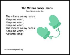 the mittens on my hands are green and have hearts attached to them with words written below