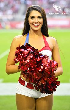 a cheerleader is posing for the camera