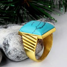 Metal: 14k Yellow Gold Turquoise*: 1.3cm x 1.8cm (0.5" x 0.7") shape - Rectangular cabochon setting type - Bezel setting *stone may vary in tone or pattern. Please allow for these natural variations. Product weight: 7.0 gr The versatile ring, that captivates with a stunning style! Created from 14k yellow gold, this ring boasts a massive blue turquoise gemstone on the top. Show this one off because it's too special to hide! See More Categories Browse Gold Turquoise Rings Browse 14K Gold Rings Bro Modern Turquoise Ring With Polished Finish, Yellow Gold Turquoise Ring With Polished Finish, Modern Blue Turquoise Gemstone Ring, Formal 14k Gold Turquoise Blue Ring, Formal Polished Turquoise Ring, Formal Turquoise Ring With Polished Finish, Modern Turquoise Anniversary Ring, Polished Turquoise Ring For Gift, Polished Turquoise Ring As Gift