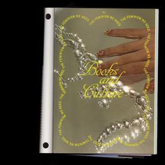 a book with pearls and gold written on it